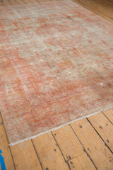 Distressed Sivas carpet corner view, highlighting pale rust patterns, soft fringe, and varied texture.