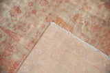 Distressed pile texture and hand-knotted weave of the vintage Sivas rug.