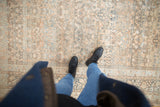 All-over floral pattern and time-softened tones of a distressed vintage Meshed rug.