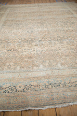 Distressed vintage Persian Meshed carpet with faded thousand flower motif and abrashes.