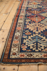 Antique Kuba rug's intact side cord selvage and geometric border with serrated guls.