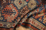 Geometric serrated gul motifs and sturdy hand-knotted pile texture of this Antique Kuba rug.