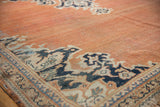 Vintage Mahal carpet minor border showing navy, sky blue, ivory palmettes, terracotta field, and knot head wear.