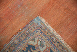 Vintage Mahal carpet's terracotta foundation, showing knot heads, pile, and patterned edge.