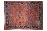 Distressed vintage Mahal rug with abrashed brick red field and colorful floral Herati border.
