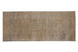 Distressed vintage Sivas carpet fragment, faded allover floral design: ivory, blue, gold tones.