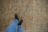 Overhead view of distressed Sivas carpet, showing tone-on-tone floral pattern with foundation wear.