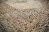 Close-up of vintage distressed Khorassan borders featuring intricate floral and pawn motifs.