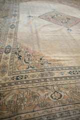 Reciprocating pawn design outer border in charcoal on a distressed vintage Khorassan carpet.