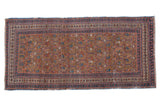 Antique Caucasian runner features ecru ground, repeating lattice, germinating boteh, indigo and madder red.