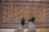 Antique Caucasian runner with lattice panels and germinating boteh motifs in ecru, blue, and madder red.