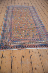 Antique Caucasian runner's ecru ground, boteh pattern, indigo and red borders, with intact side selvage.