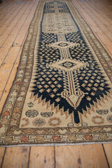 Vintage distressed Malayer runner with navy blue field, beige boteh and Herati design.
