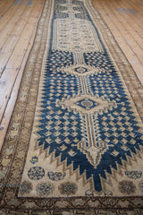 Vintage Malayer runner, navy blue boteh motifs, beige field, and even pile wear.