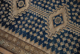 Distressed Malayer runner: serrated edge joins beige geometric border to navy boteh field.