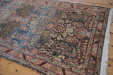 Distressed Dargezine runner's floral motifs, showing abrashes and faded blue hues.