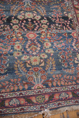 Intricate distressed Dargezine runner, floral design in denim blue, terra cotta, and visible abrashes.