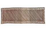 Vintage distressed Hamadan rug runner with diagonal striations in earthy brown, beige, and ivory tones.