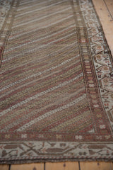 The even, low-pile texture of a vintage Hamadan runner with diagonal striped striations.