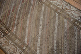Even wear across the hand-knotted pile of a distressed Hamadan runner with diagonal striations.