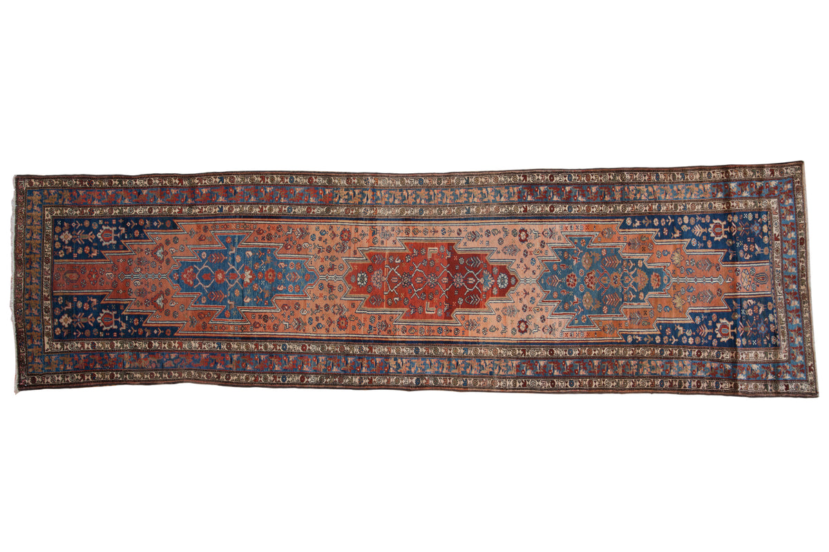 Vintage distressed Malayer runner with a triple center medallion in rust, cobalt blue, and dusty rose.