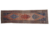 Vintage distressed Malayer runner with a triple center medallion in rust, cobalt blue, and dusty rose.