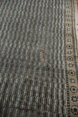 Distressed Anatolian runner detail: geometric water motif, worn pile, and visible foundation.
