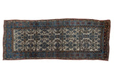 Distressed vintage Kurdish Bijar runner with an ivory Herati field and blue vine borders, 4'7