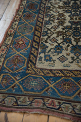 Distressed Kurdish Bijar runner: sky blue border with finned floral blossoms and Herati field.