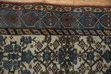 Distressed Kurdish Bijar rug: sky blue cartouche border with floral patterns and ivory field.