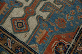 Distressed texture and geometric patterns in indigo, rust, and beige.