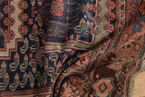 Hand-knotted vintage Malayer rug showing dense navy field patterns and classic Herati border.