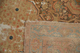 Distressed vintage Malayer rug with worn pile, exposed foundation, and reverse weave.