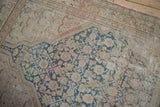 Vintage Malayer rug's distressed beige field with sky blue Herati pattern and pale terra cotta vines.