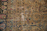 Vintage distressed Meshed carpet: camel field, navy vines, pink blossoms, and worn texture.