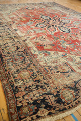 Antique Persian Serapi carpet detail: wide serrated leaf border, geometric vinery, and rich patina.