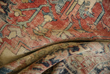 Antique Serapi carpet detail: visible foundation, knot head wear, brick red geometric patterns.