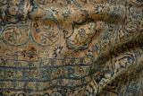 Distressed Persian Meshed carpet detail: sand, navy, teal floral patterns with visible wear.