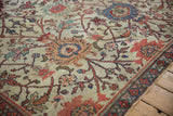 Antique Mahal carpet ivory field, terra cotta scrolling vinery, lotus flowers, and wear.