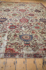Visible foundation and worn pile on an antique Mahal carpet, with ivory and terra cotta florals.