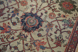 Detail of antique Mahal carpet displaying exposed foundation and worn pile amidst scrolling floral vinery.