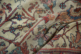 Close-up of antique Mahal carpet, showing floral patterns and visible foundation wear.