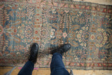 Distressed Dargezine runner with pale denim blue abrashes and intricate floral blossom design.