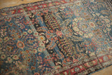 Distressed blue field with thousand flower blossom motif and prominent color abrashes.