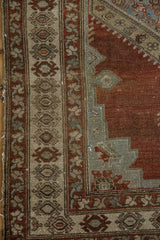 Distressed vintage Malayer rug, chestnut brown field, geometric slate blue and beige border.