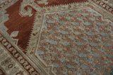 Distressed vintage Malayer rug pile featuring pale slate blue and copper boteh lattice.