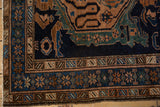 Corner detail of a vintage Malayer showing its intact side cord selvage and intricate floral borders.