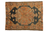 Distressed vintage Malayer rug with large medallion, floral motifs, dusty navy, and rose tones, 3'2