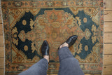 Distressed hand-knotted Malayer rug with abrashed field in dusty navy blue and pale rose.