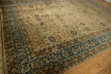 Distressed Meshed carpet's sky blue border with intricate camel and copper floral vinery.
